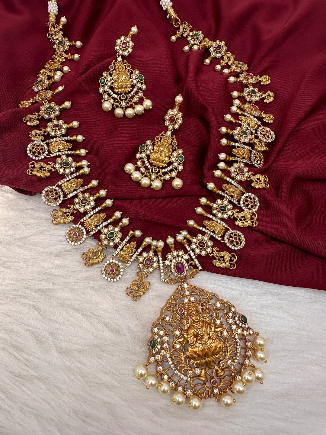 heavy lakshmi temple imitation necklace set with AD stones and pearl drops bridal jewellery